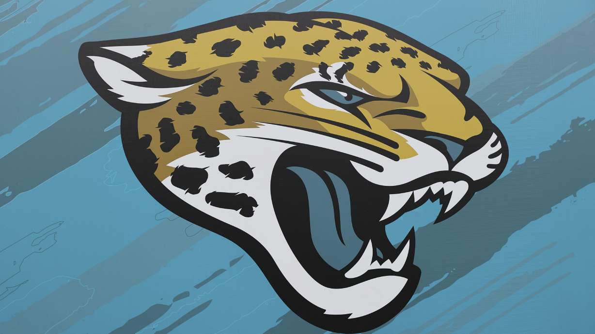 FILE - Jacksonville Jaguars signage is shown at TIAA Bank Field stadium at an NFL football game between the Pittsburgh Steelers and the Jaguars, Saturday, Aug. 20, 2022 in Jacksonville, Fla. A former Jacksonville Jaguars financial manager who pled guilty to stealing more than $22 million from the NFL franchise through its virtual credit card program was sentenced to 78 months in federal prison Tuesday, March 12, 2024..