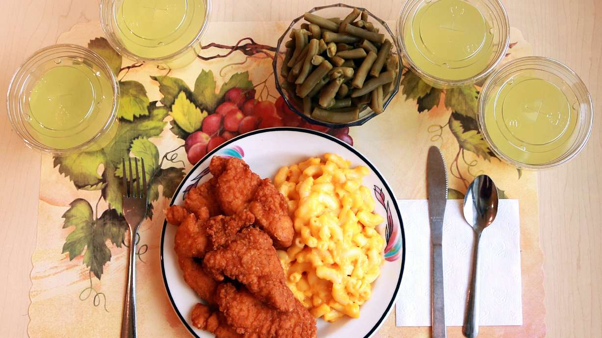An "ultra-processed" lunch including macaroni and cheese, chicken tenders, canned green beans and diet lemonade. A new analysis of recent studies says consuming lots of ultra-processed food could lead to dozens of health problems.
