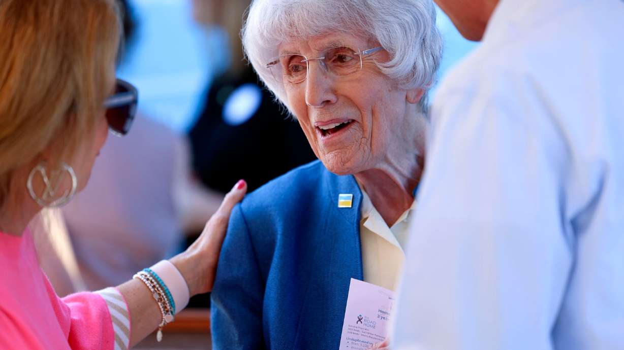 Pamela Atkinson speaks with Christina Huntsman Durham and David Hunstman in South Salt Lake on Oct. 6, 2022. Atkinson and Steven G. Parker will be awarded honorary doctorate degrees from the University of Utah.