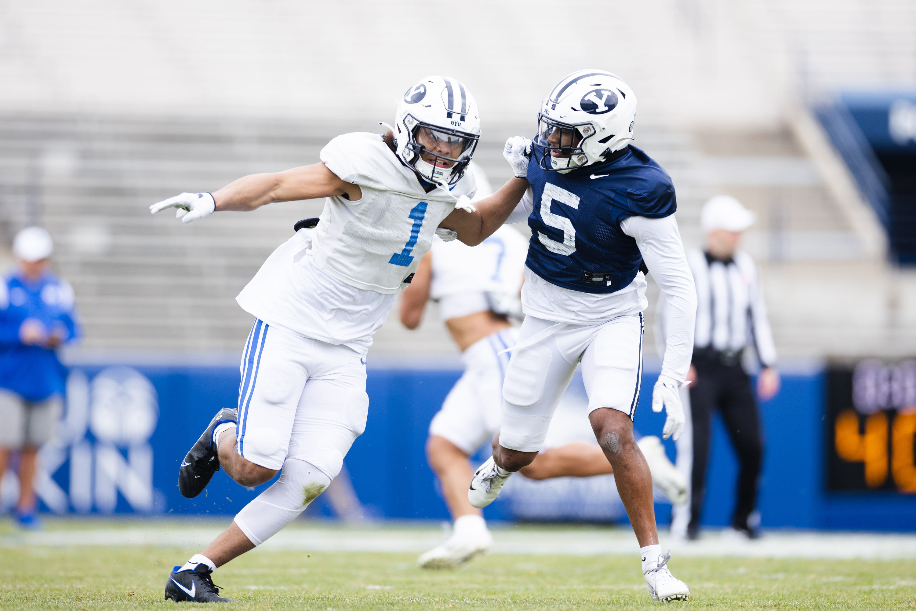 BYU Cougars wide receiver Keanu Hill (1) runs a route against Cougars defensive back D'Angelo Mandell (5) during the annual BYU Blue vs. White scrimmage at LaVell Edwards Stadium in Provo on Friday, March 31, 2023.
