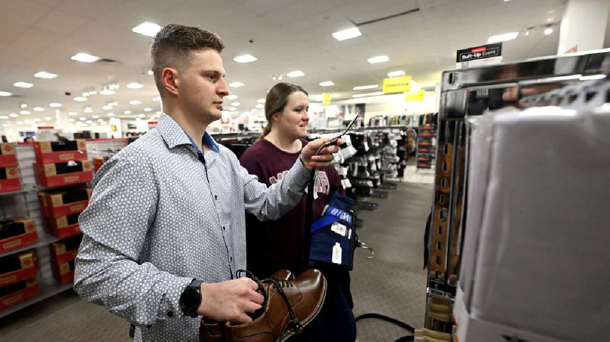 Cole and Darcy Warner shop for dress clothing as part of the Suit-Up sale at JCPenny in Riverdale on Tuesday.