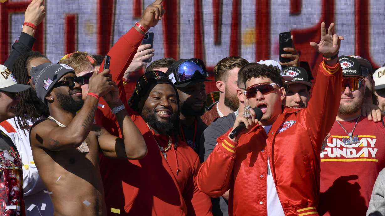 Kansas City Chiefs quarterback Patrick Mahomes, right, tells the crowd the Chiefs want to win another Super Bowl next season, during their victory rally in Kansas City, Mo., Wednesday, Feb. 14, 2024. The Chiefs defeated the San Francisco 49ers Sunday in the NFL Super Bowl 58 football game.
