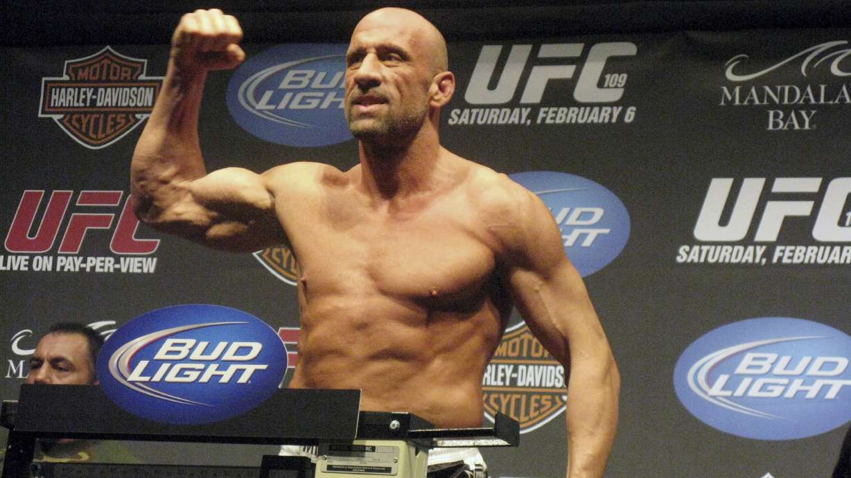 FILE - UFC Hall of Famer Mark Coleman gestures during the weigh-in ahead of his UFC 109 fight against Randy Couture Friday, Feb. 5, 2010, in Las Vegas. Former UFC champion Mark Coleman was airlifted to a hospital and was “battling for his life” after saving his parents from a house fire in Ohio this week, his daughter said on Instagram. Morgan Coleman posted Tuesday night, March 12, 2024, that her father went into the burning house several times and was able to bring out his mother and father.