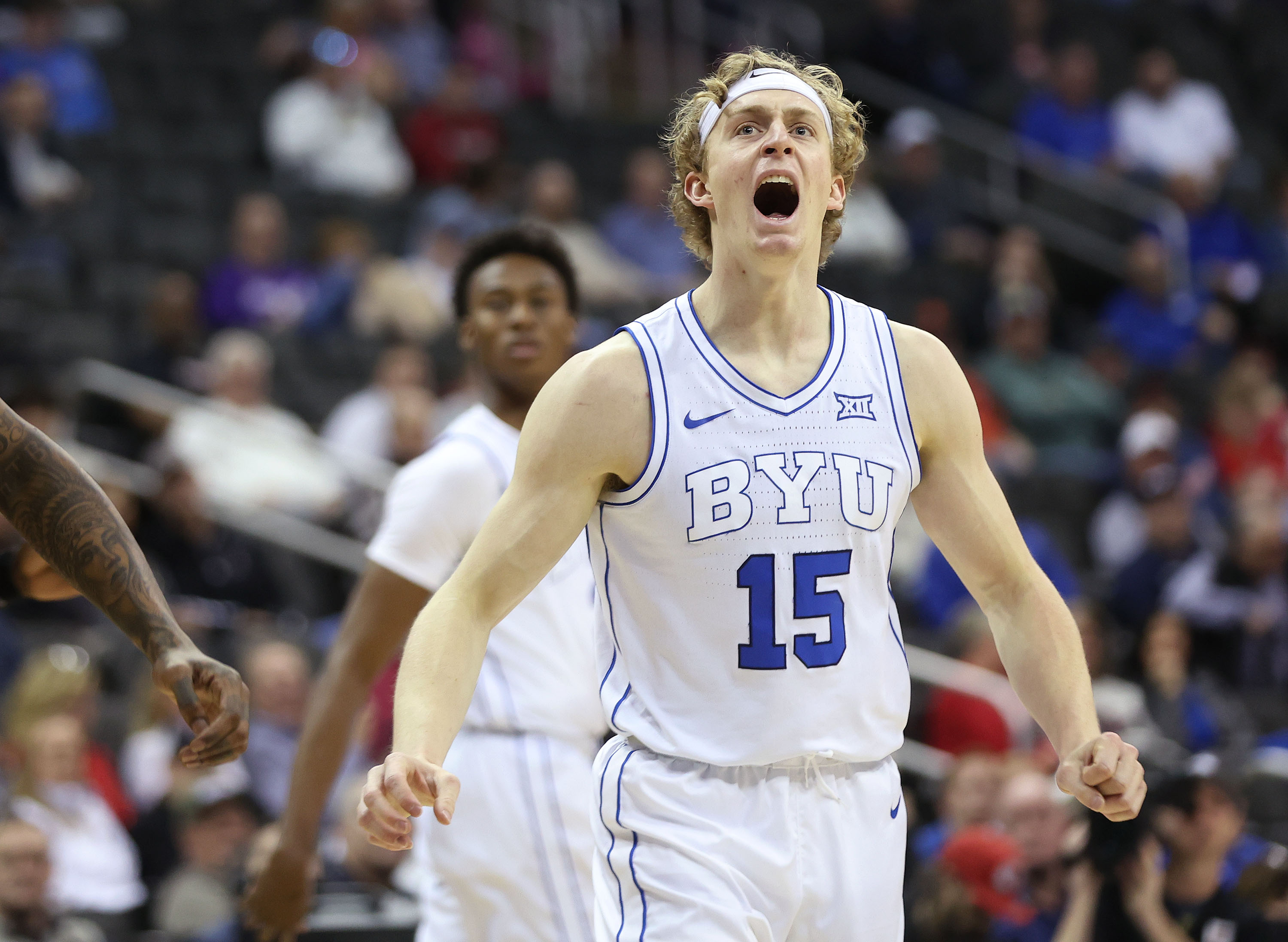 Brigham Young guard Richie Saunders (15) celebrates a three-pointer during the Big 12 conference tournament against UCF in Kansas City on Wednesday, March 13, 2024. BYU won 87-73.