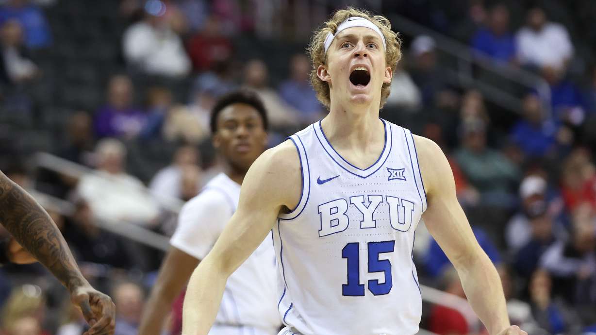 Brigham Young guard Richie Saunders (15) celebrates a three-pointer during the Big 12 conference tournament against UCF in Kansas City on Wednesday, March 13, 2024. BYU won 87-73.