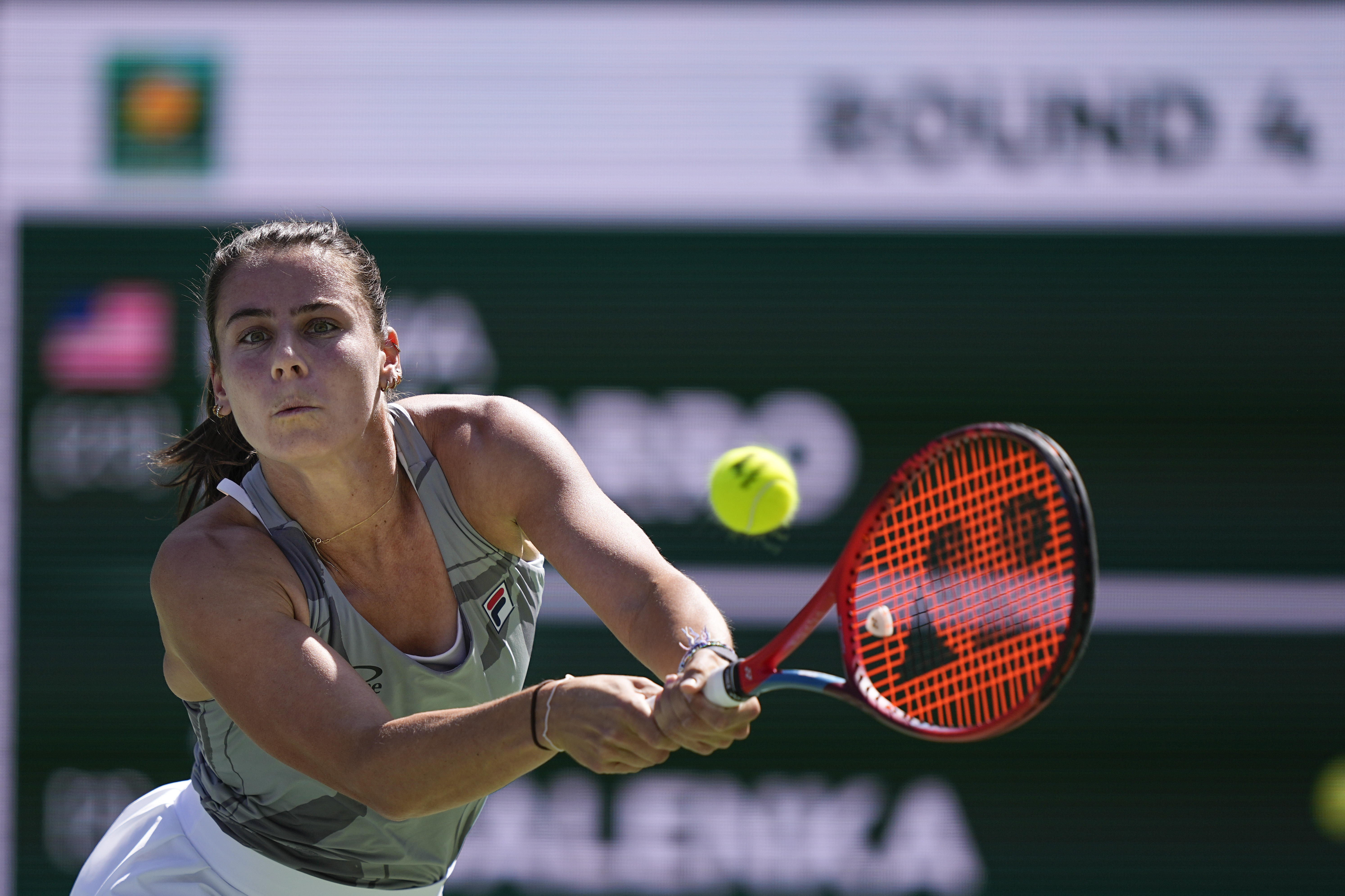 Emma Navarro, of the United States, returns to Aryna Sabalenka, of Belarus, at the BNP Paribas Open tennis tournament, Wednesday, March 13, 2024, in Indian Wells, Calif. 