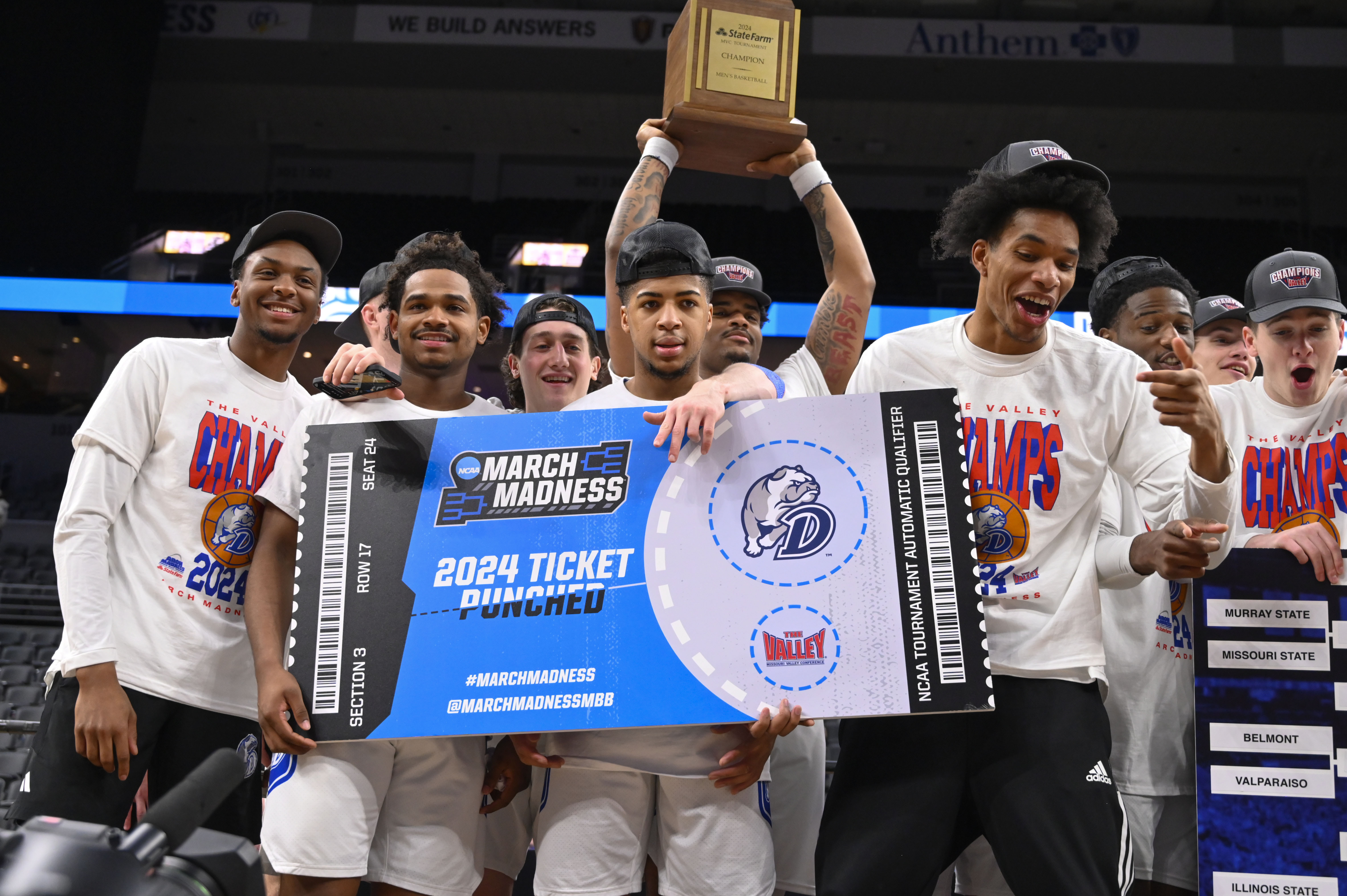 Members of Drake hold a sign signifying that they are going to the March Madness tournament after beating Indiana State after the championship game in the Missouri Valley Conference NCAA basketball tournament, Sunday, March 10, 2024, in St. Louis. 