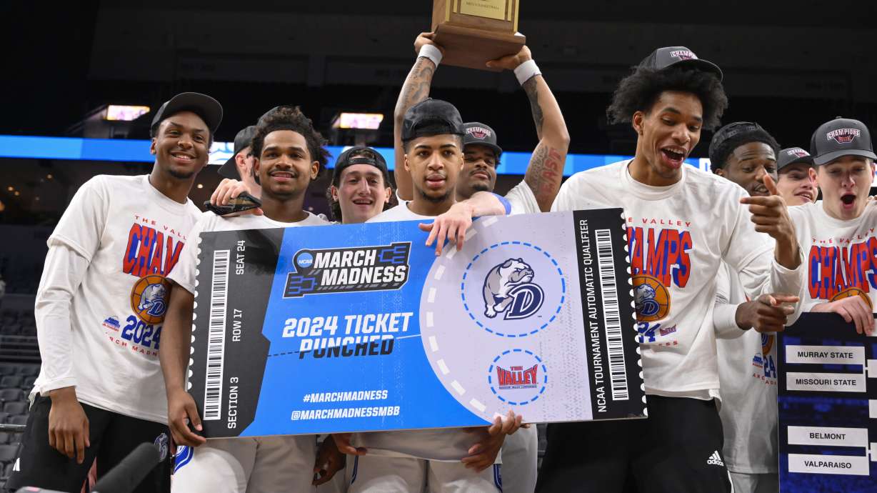 Members of Drake hold a sign signifying that they are going to the March Madness tournament after beating Indiana State after the championship game in the Missouri Valley Conference NCAA basketball tournament, Sunday, March 10, 2024, in St. Louis.