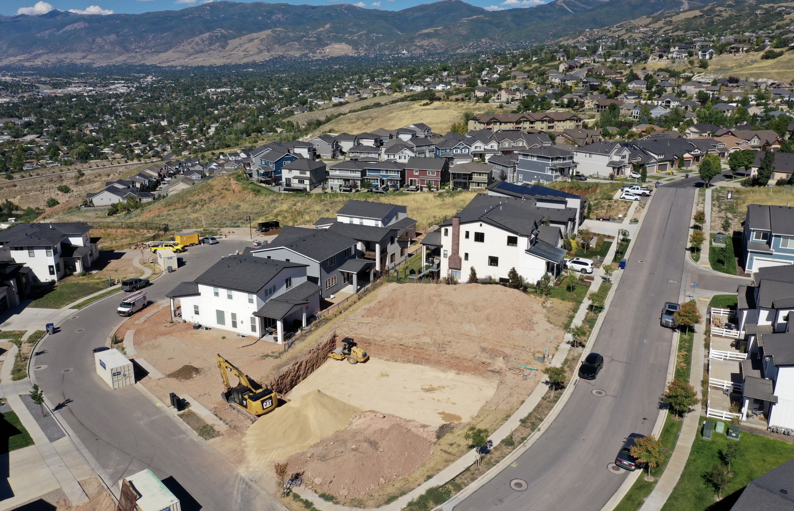 Homes and a construction site are pictured in North Salt Lake on Aug. 28, 2023. About 60% of the U.S.'s counties experienced growth over the past year, including three-fourths of Utah's counties, per federal data released on Thursday.