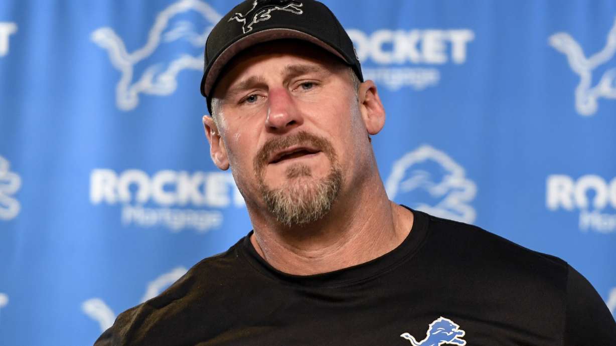 FILE - Detroit Lions head coach Dan Campbell talks to reporters following an NFL football NFC divisional playoff game against the Tampa Bay Buccaneers, Sunday, Jan. 21, 2024, in Detroit. With the franchise coming off its best season in 32 years, the Detroit Lions have extended the contracts of coach Dan Campbell and general manager Brad Holmes through the 2027 season.
