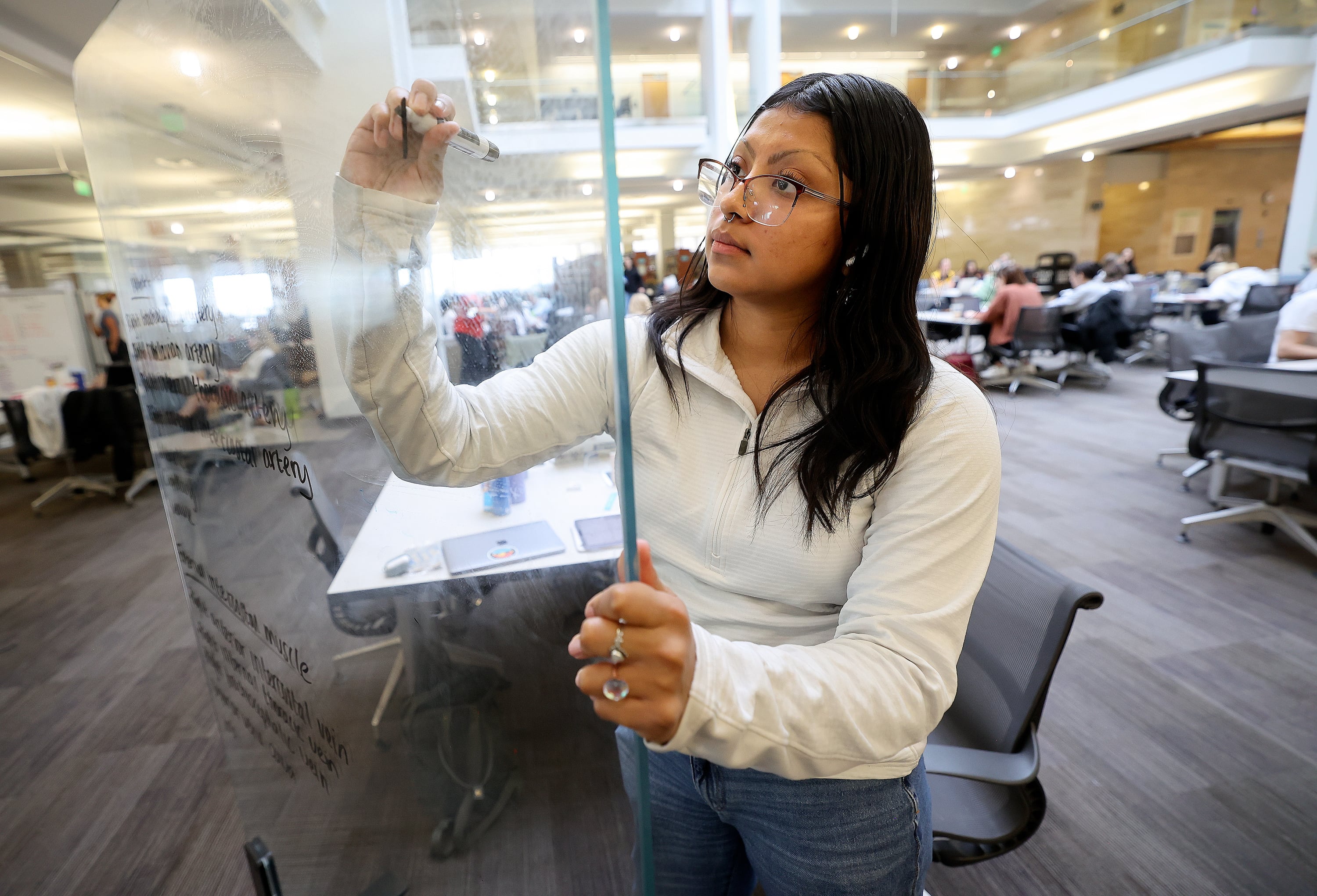 University of Utah student Emely Sanchez, who has federal student aid, studies for anatomy at the J. Willard Marriott Library at the University of Utah in Salt Lake City on Wednesday.
