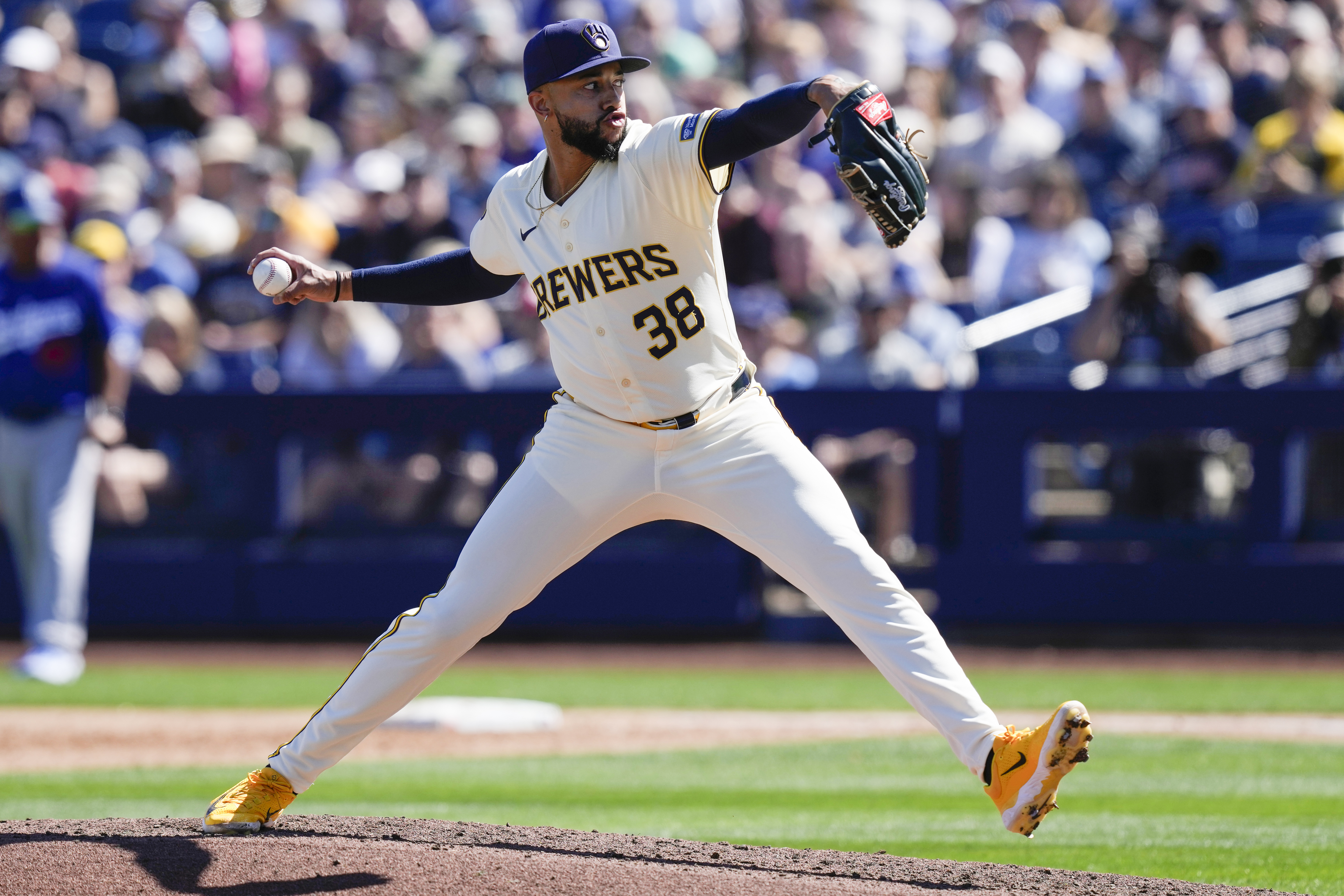 Milwaukee Brewers pitcher Devin Williams throws during the third inning of a spring training baseball game against the Los Angeles Dodgers, Saturday, March 2, 2024, in Phoenix.