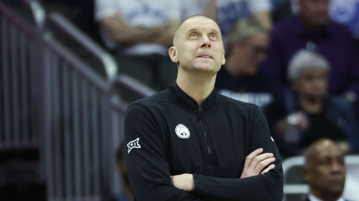 Brigham Young head coach Mark Pope looks at the replay against Texas Tech during the Big 12 conference championship in Kansas City on Thursday, March 14, 2024.