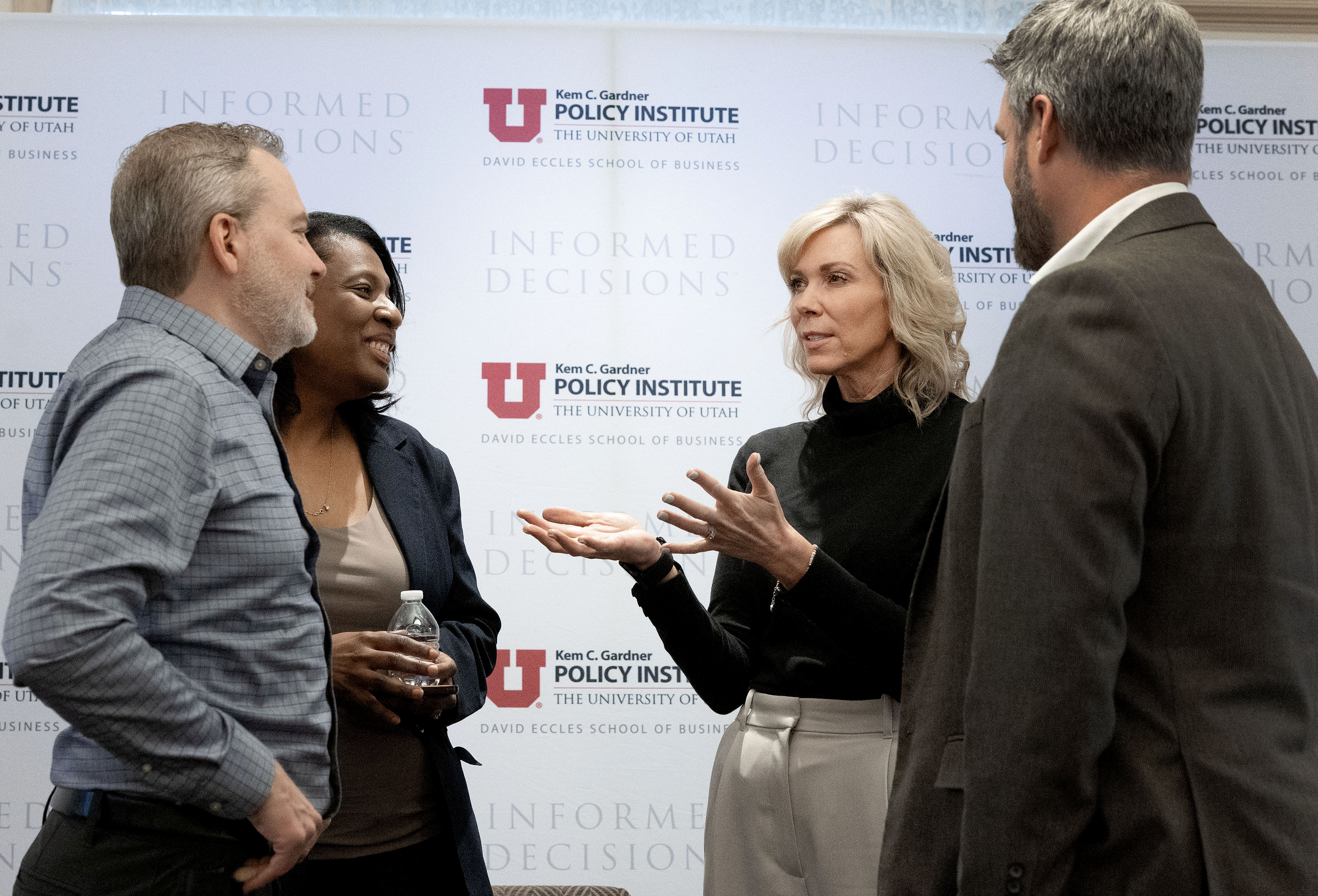 Sen. Lincoln Fillmore, R-South Jordan; Rep. Sandra Hollins, D-Salt Lake City; Amanda Covington, Larry H. Miller Company; and Mike Maughan, Smith Entertainment Group, gather after speaking at the Kem C. Gardner Policy Institute’s Newsmaker Breakfast at the Thomas S. Monson Center in Salt Lake City on Wednesday. The status of trying to bring new professional sports franchises to Utah was the center of the discussion.