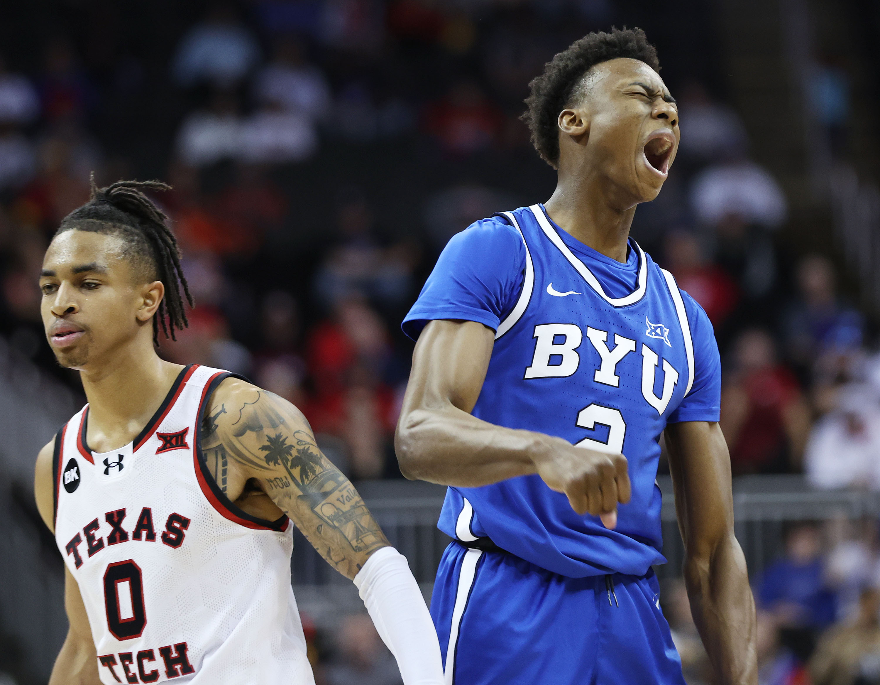 Brigham Young guard Jaxson Robinson (2) hits a 3 against Texas Tech Red Raiders guard Chance McMillian (0) during the Big 12 conference championship in Kansas City, Mo., on Thursday, March 14, 2024. Texas Tech won 81-67.