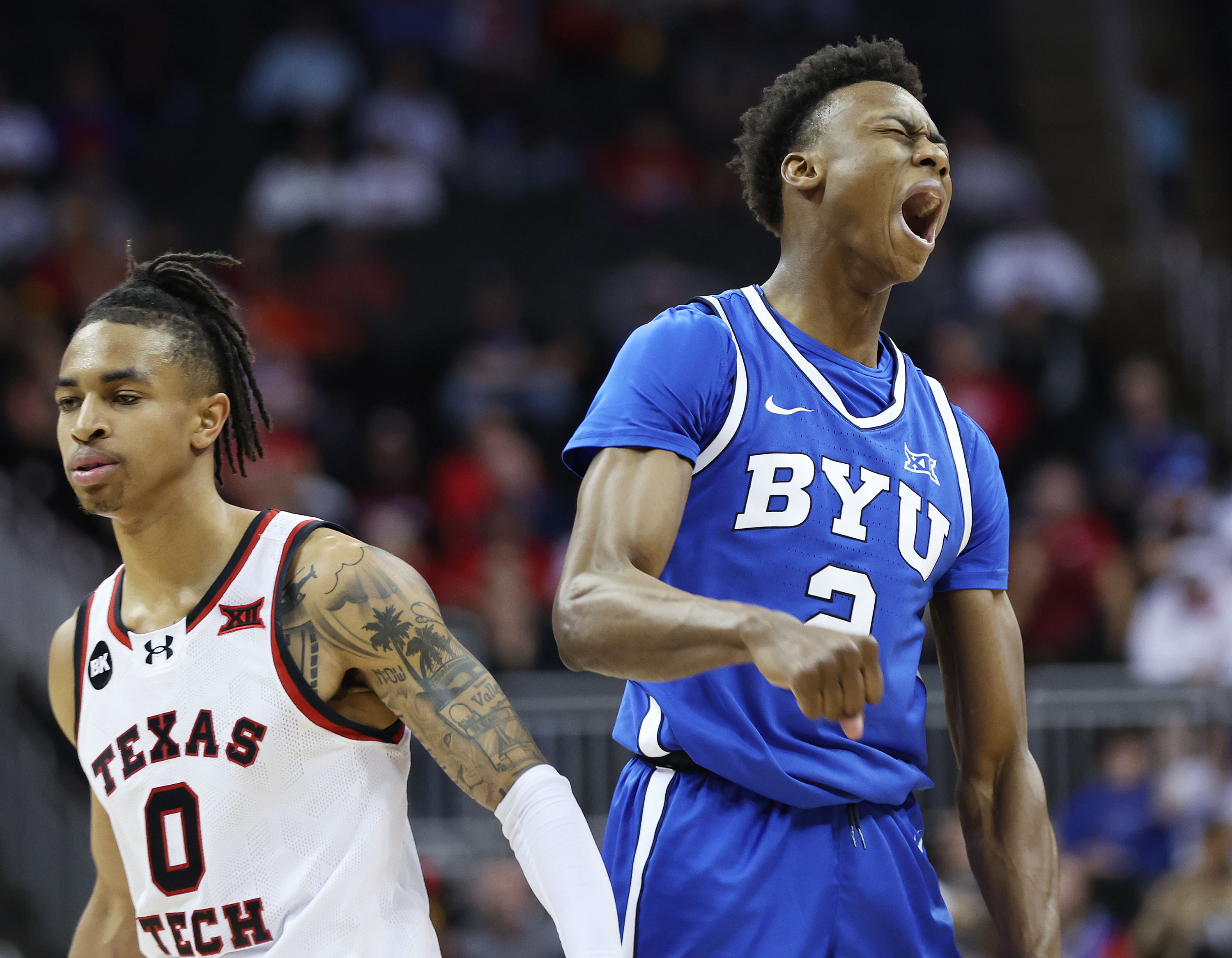 Brigham Young guard Jaxson Robinson (2) hits a 3 against Texas Tech Red Raiders guard Chance McMillian (0)  during the Big 12 conference championship in Kansas City, Mo., on Thursday, March 14, 2024. Texas Tech won 81-67.