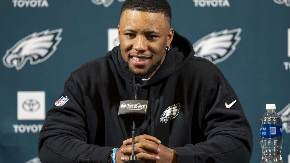 Philadelphia Eagle's Saquon Barkley talks to the media during a press conference after signing with the NFL football team, Thursday, March 14, 2024, in Philadelphia.