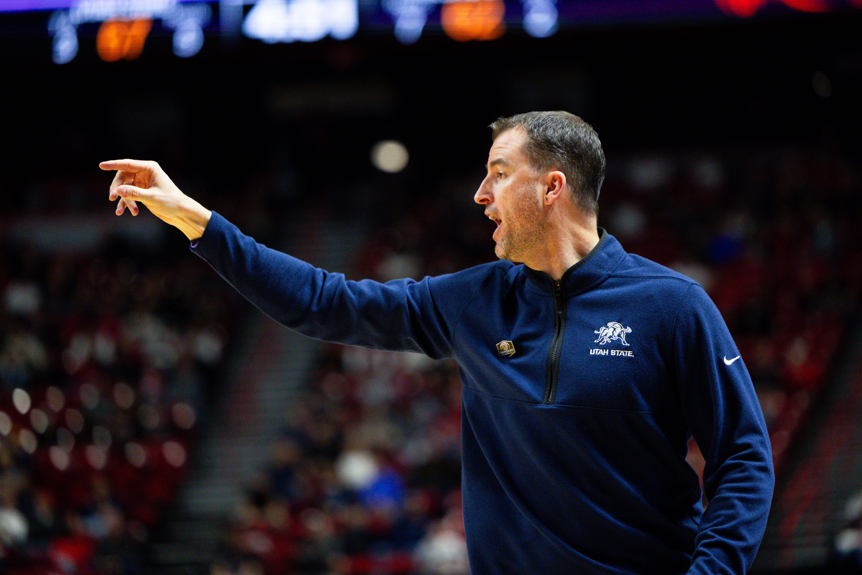 Utah State Aggies head coach Danny Sprinkle yells during the game between the Utah State Aggies and the Fresno State Bulldogs in the quarterfinals of the Mountain West 2024 Men's Basketball Championship at the Thomas & Mack Center in Las Vegas on Thursday, March 14, 2024.