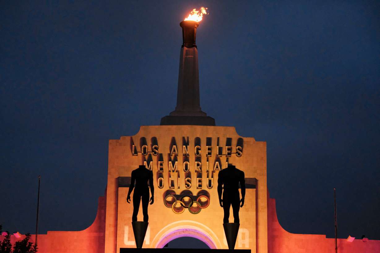 A blazing Olympic cauldron is seen at the Los Angeles Memorial Coliseum on Sept. 13, 2017. Los Angeles was named the host of the 2028 Summer Games nearly seven years ago by the International Olympic Committee.