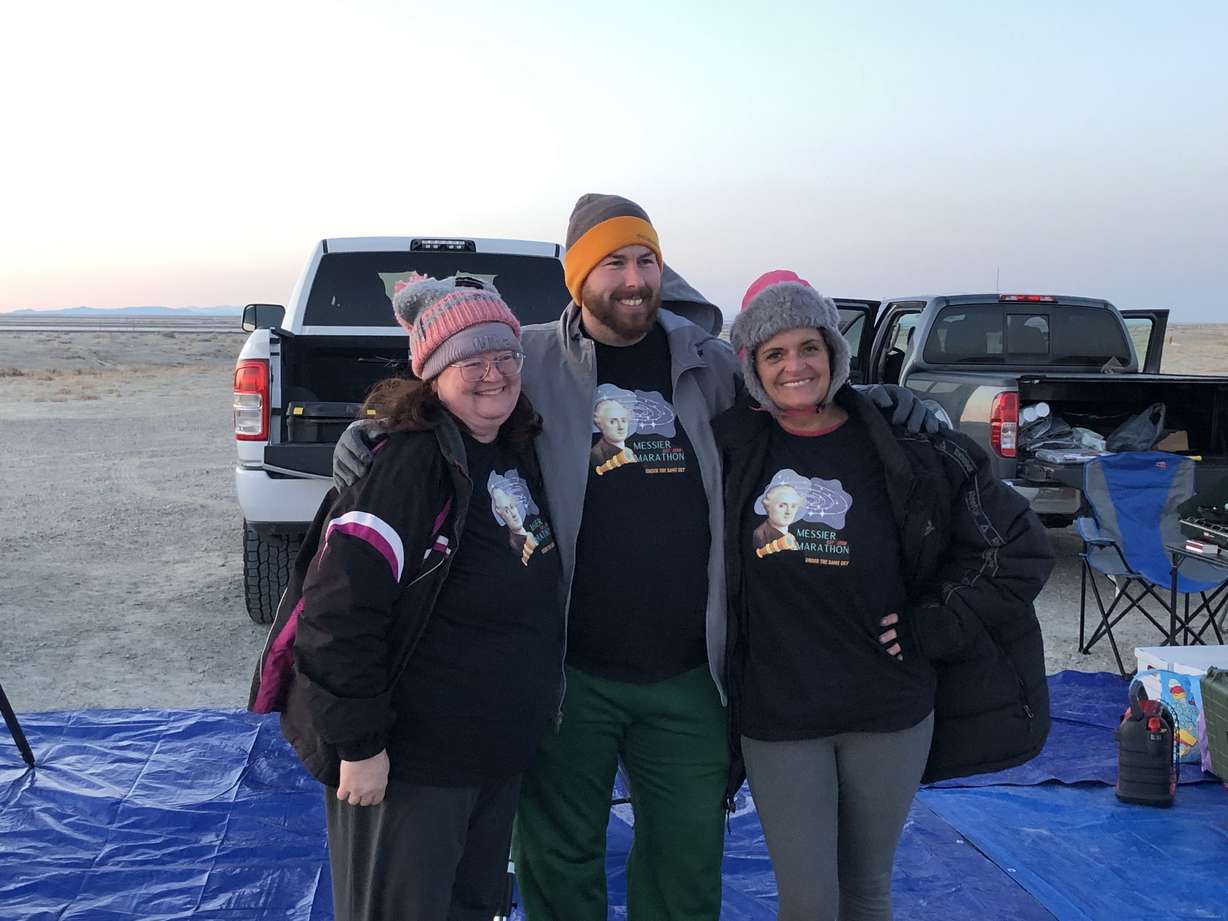 Jenette Scott, Max Byerly and Leslie Fowler, right, pose in their custom Messier Marathon shirts, before the night of stargazing began and they were forced to cover up. Fighting cold and sleepiness, the three found and identified nearly all 110 Messier deep-sky objects all in one night.