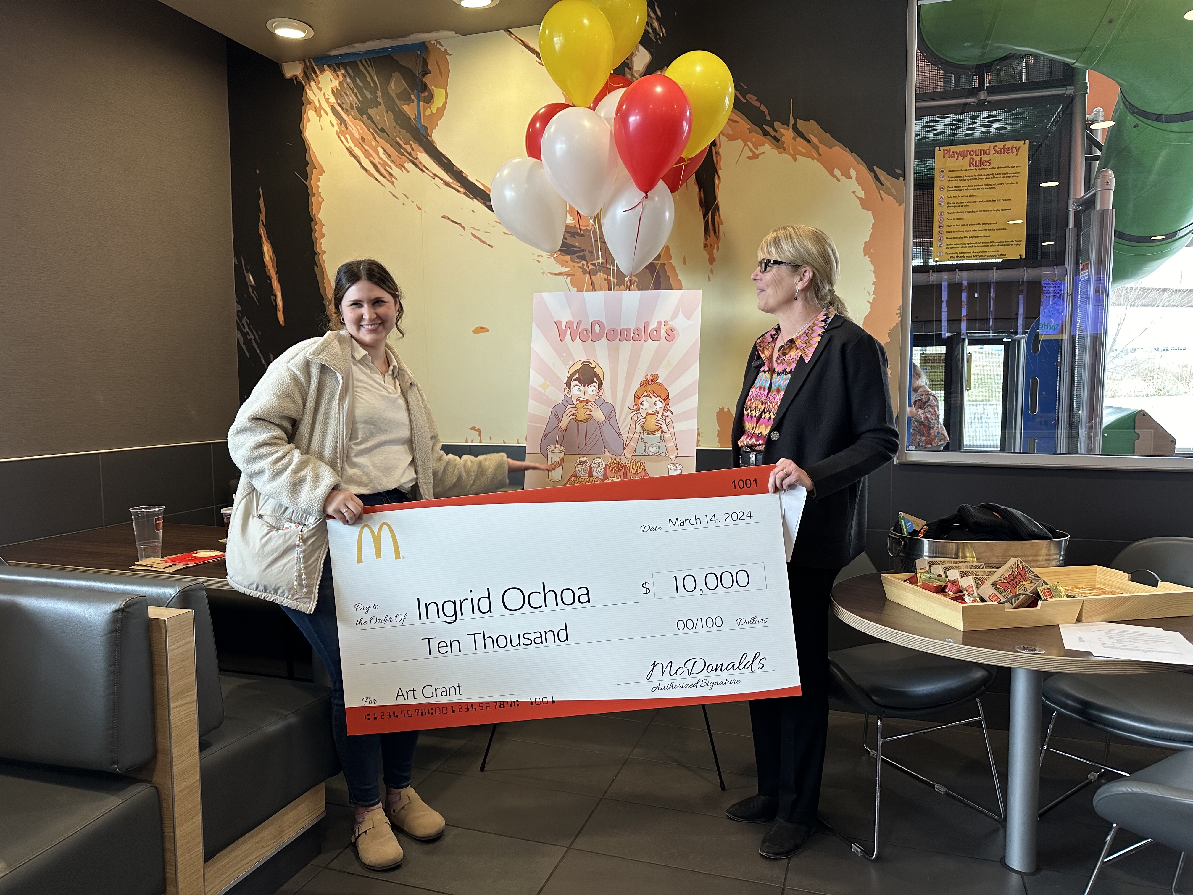 Lehi artist Ingrid Ochoa, 34, shows off the "WcDonald's" anime artwork that won her a $10,000 grant from McDonald's on Thursday in Lehi. 