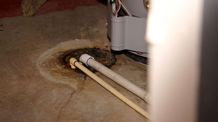 Tyler and Jen Erickson say sewage began flowing from this floor drain, filling the basement of their Farmington home with 5 to 6 inches of sewer water.