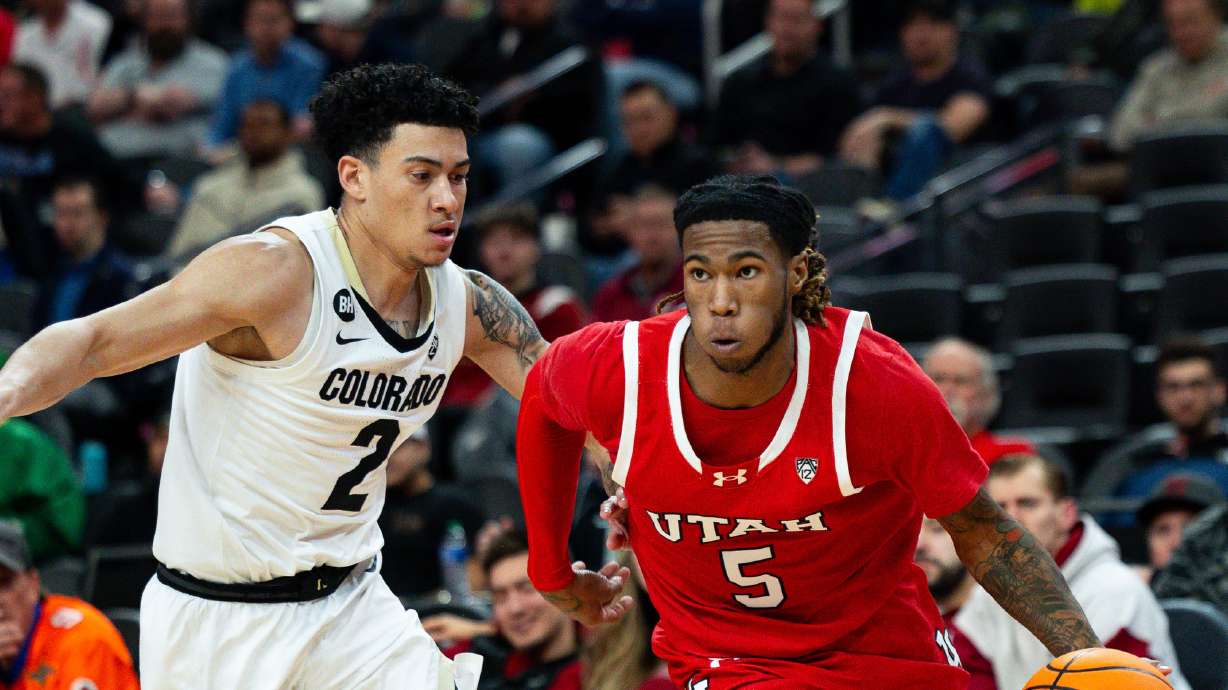 Utah Utes guard Deivon Smith (5) drives the ball down the court with Colorado Buffaloes guard KJ Simpson (2) on defense during the game between the Utah Utes and the Colorado Buffaloes in the quarterfinals of the 2024 Pac-12 men’s basketball tournament at the T-Mobile Arena in Las Vegas on Thursday, March 14, 2024.