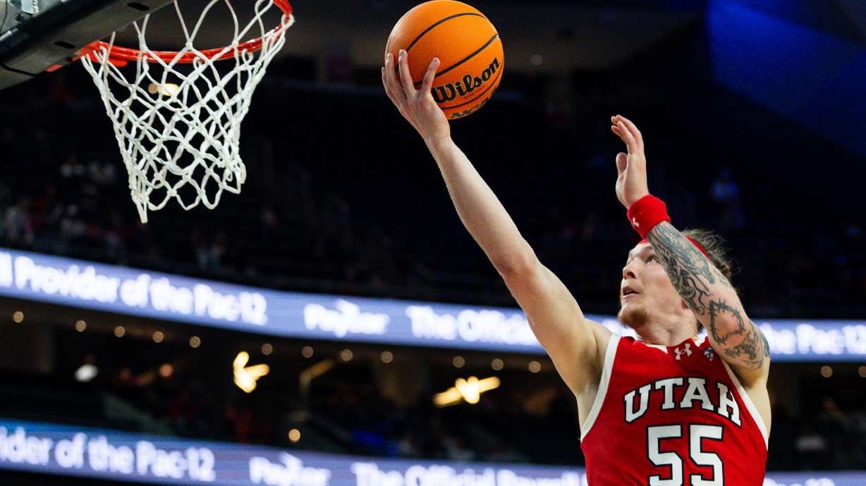 Utah Utes guard Gabe Madsen (55) shoots the ball during the game between the Utah Utes and the Colorado Buffaloes in the quarterfinals of the 2024 Pac-12 Men’s Basketball Tournament at the T-Mobile Arena in Las Vegas on Thursday, March 14, 2024.