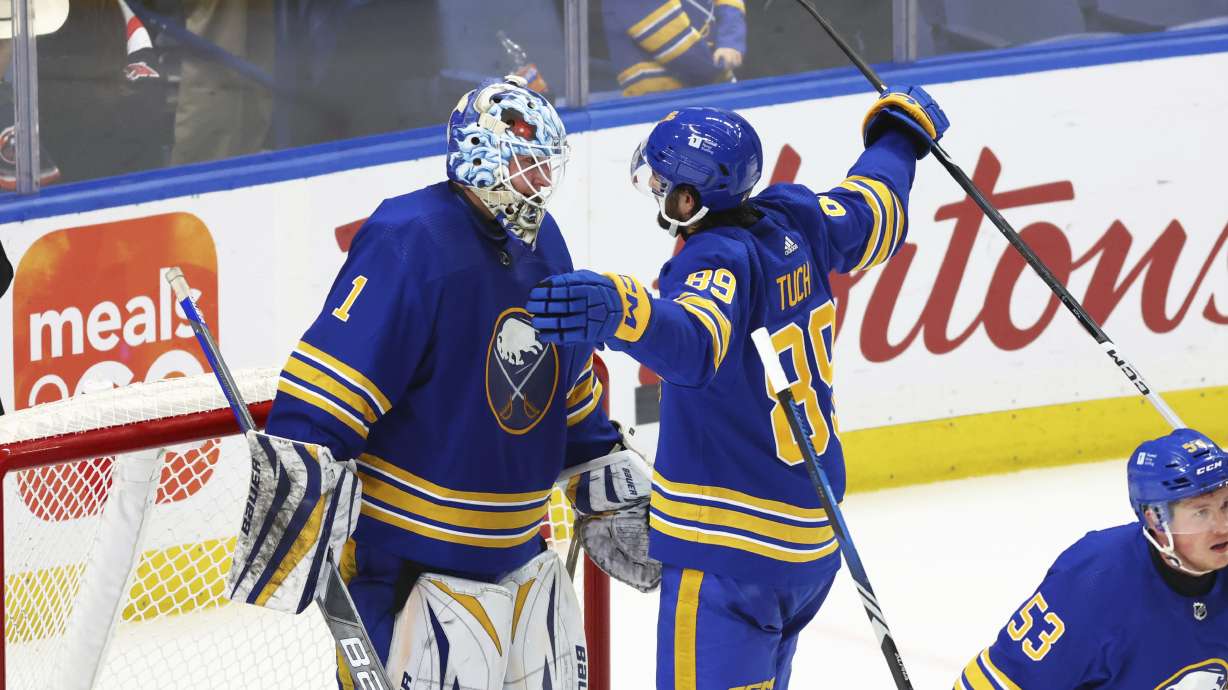 Buffalo Sabres goaltender Ukko-Pekka Luukkonen (1) and right wing Alex Tuch (89) celebrate after an NHL hockey game against the New York Islanders, Thursday, March 14, 2024, in Buffalo, N.Y.