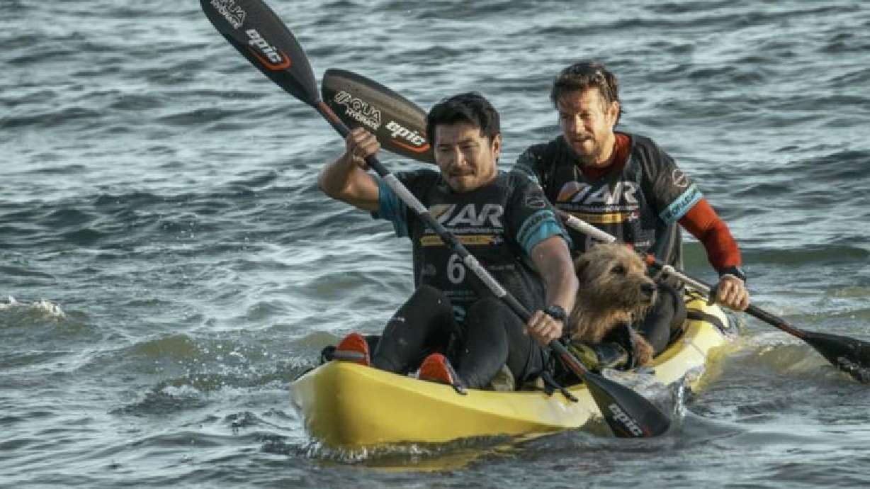 Mark Wahlberg, right, and Ukai the dog appear in "Arthur the King," a remarkable true story of the connection formed by an adventure racer and a stray dog in the middle of the Ecuadorian jungle.