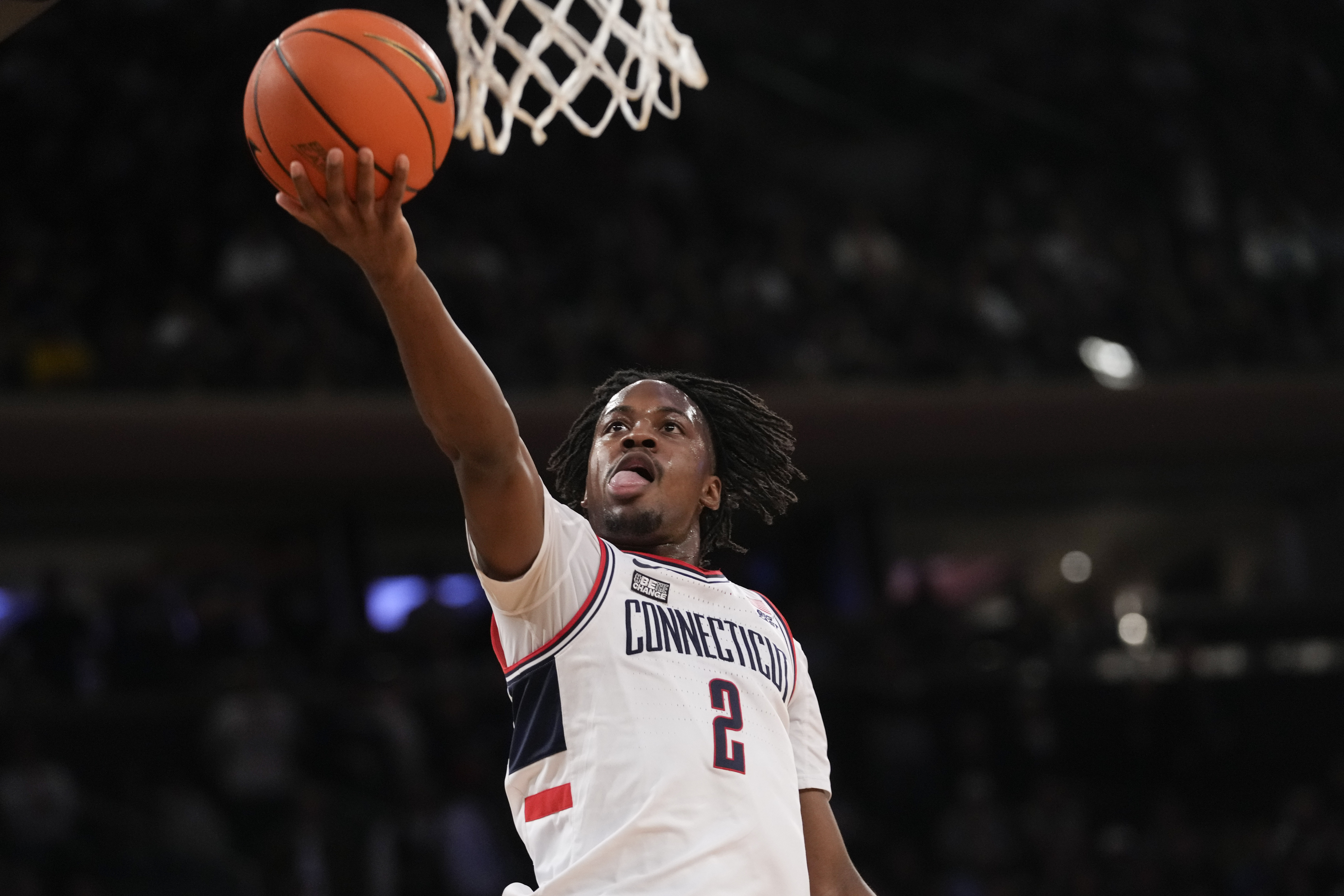 UConn guard Tristen Newton goes to the basket during the first half of the team's NCAA college basketball game against St. John's in the semifinals of the Big East men's tournament Friday, March 15, 2024, in New York.