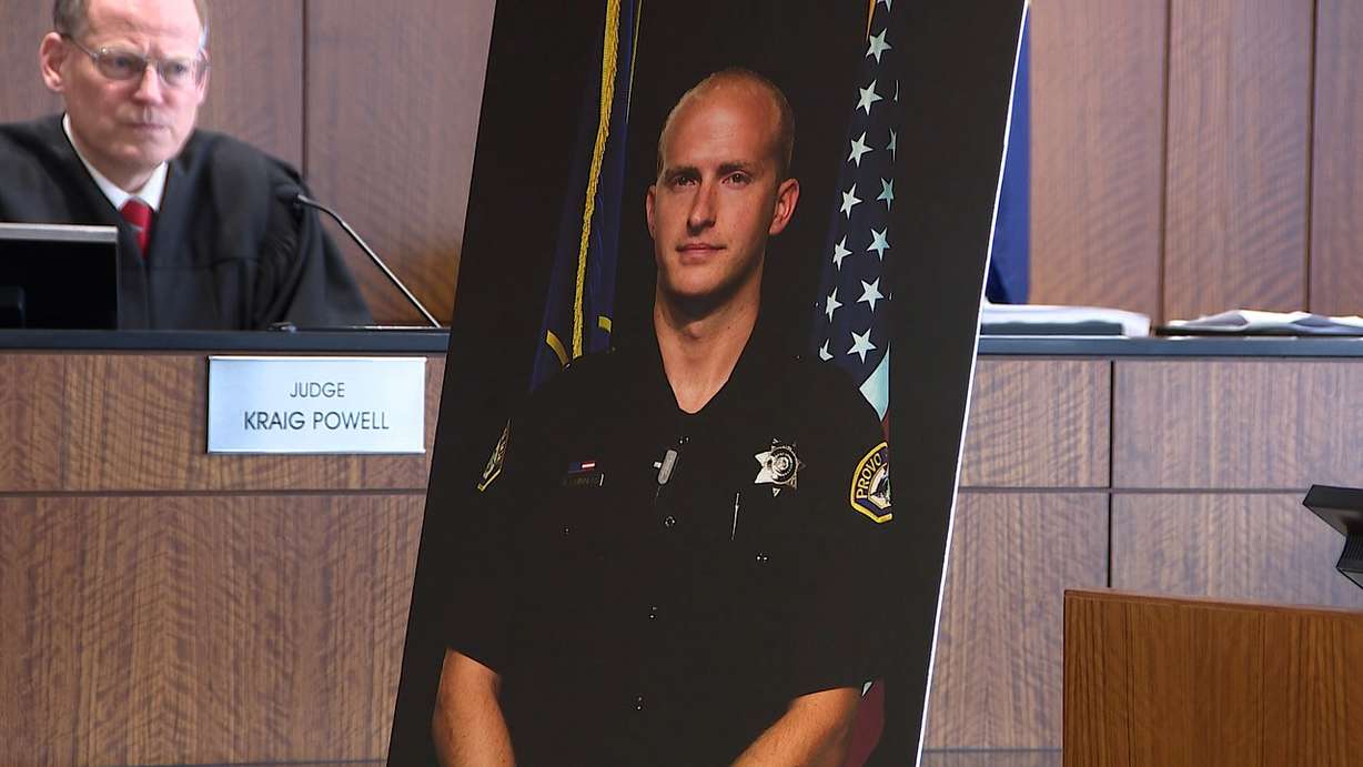 A portrait of Provo police officer Joseph Shinners is on display in a courtroom during the trial of his killer, Matt Frank Hoover. Hoover was found guilty of aggravated murder on Friday for shooting and killing Shinners in January 2019.