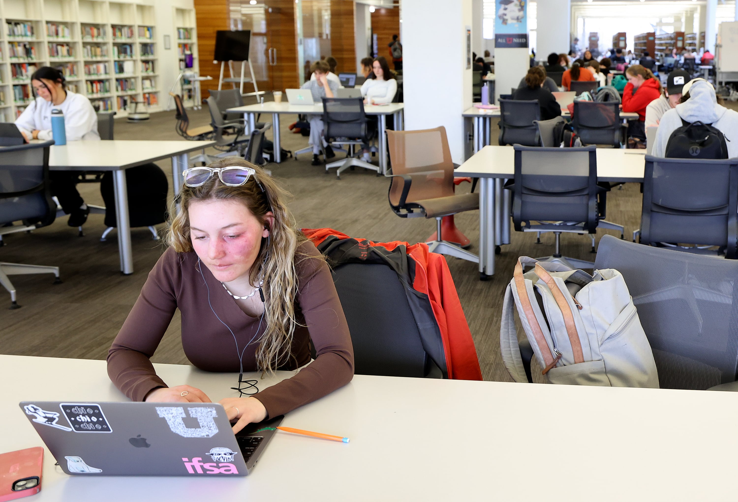 University of Utah freshman Gabby Leonardo studies in the J. Willard Marriott Library at the University of Utah in Salt Lake City on Wednesday. Tuition will likely go up at Utah's public colleges and universities next fall.