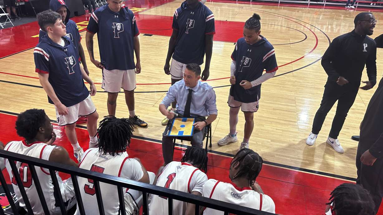 Antelope Valley coach Jordan Mast talks with his team during a timeout during a first-round game against Huntington (Indiana) in the NAIA men's basketball tournament Friday, March 15, 2024, in Glendale, Ariz. Antelope Valley lost 85-71 to end the season with a 26-5 record. Now they'll head back to California with no college to return to, but with their heads held high after the group persevered through a few uncertain months.