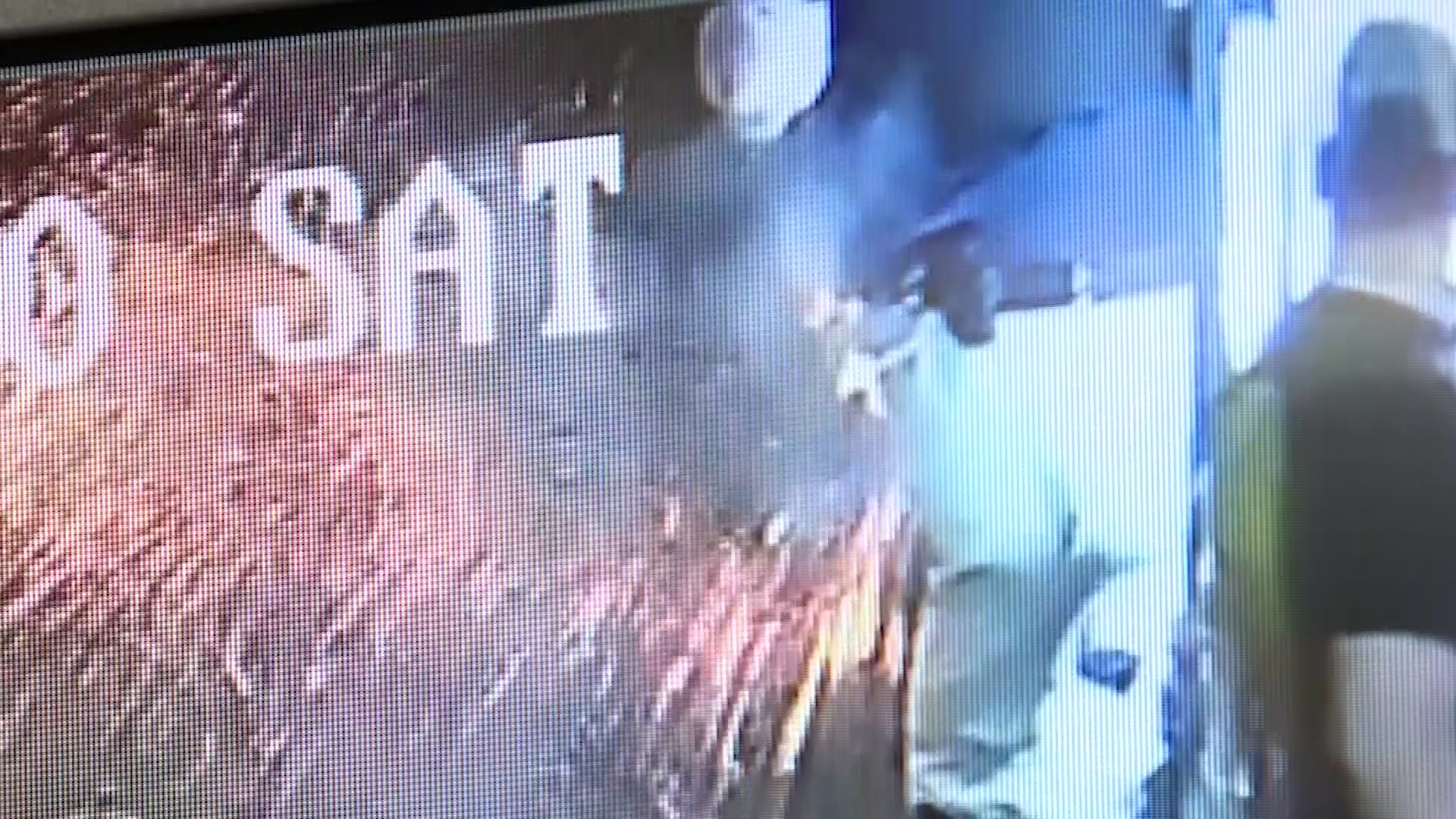 Christopher Kendall swats the battery away as his pants caught on fire, in surveillance camera footage.