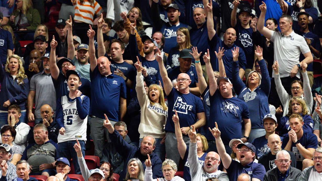 Utah State Aggies fans sing "The Scotsman" during the game between the Utah State Aggies and the San Diego State Aztecs in the semifinals of the Mountain West 2024 Men's Basketball Championship at the Thomas & Mack Center in Las Vegas on Friday, March 15, 2024.