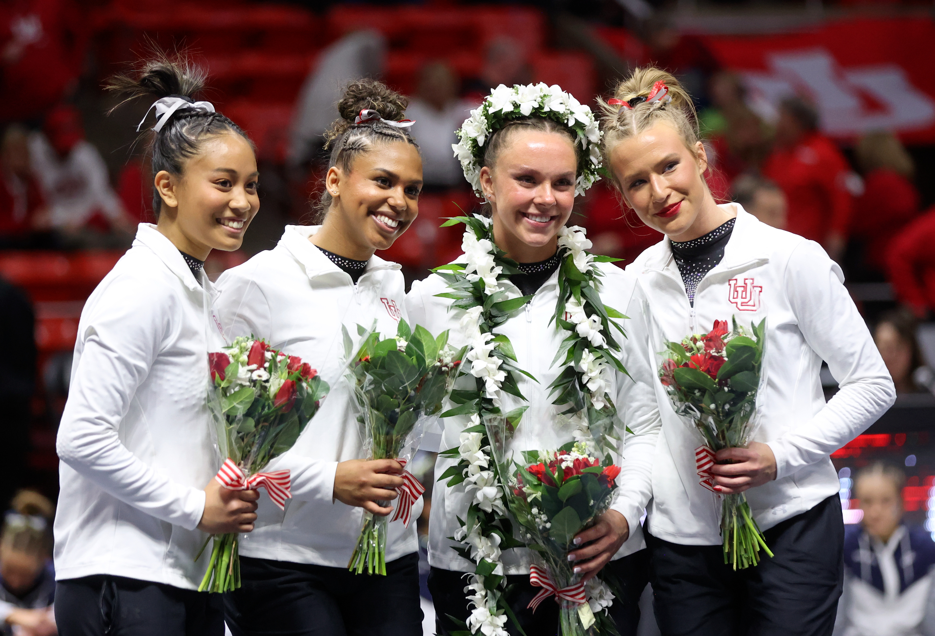 Utah Red Rocks seniors Alani Sabado, Jaedyn Rucker, Maile O'Keefe and Abby Paulson are honored after a gymnastics meet against Stanford and Utah State University at the Huntsman Center in Salt Lake City on Friday, March 15, 2024. The Utah Red Rocks won.