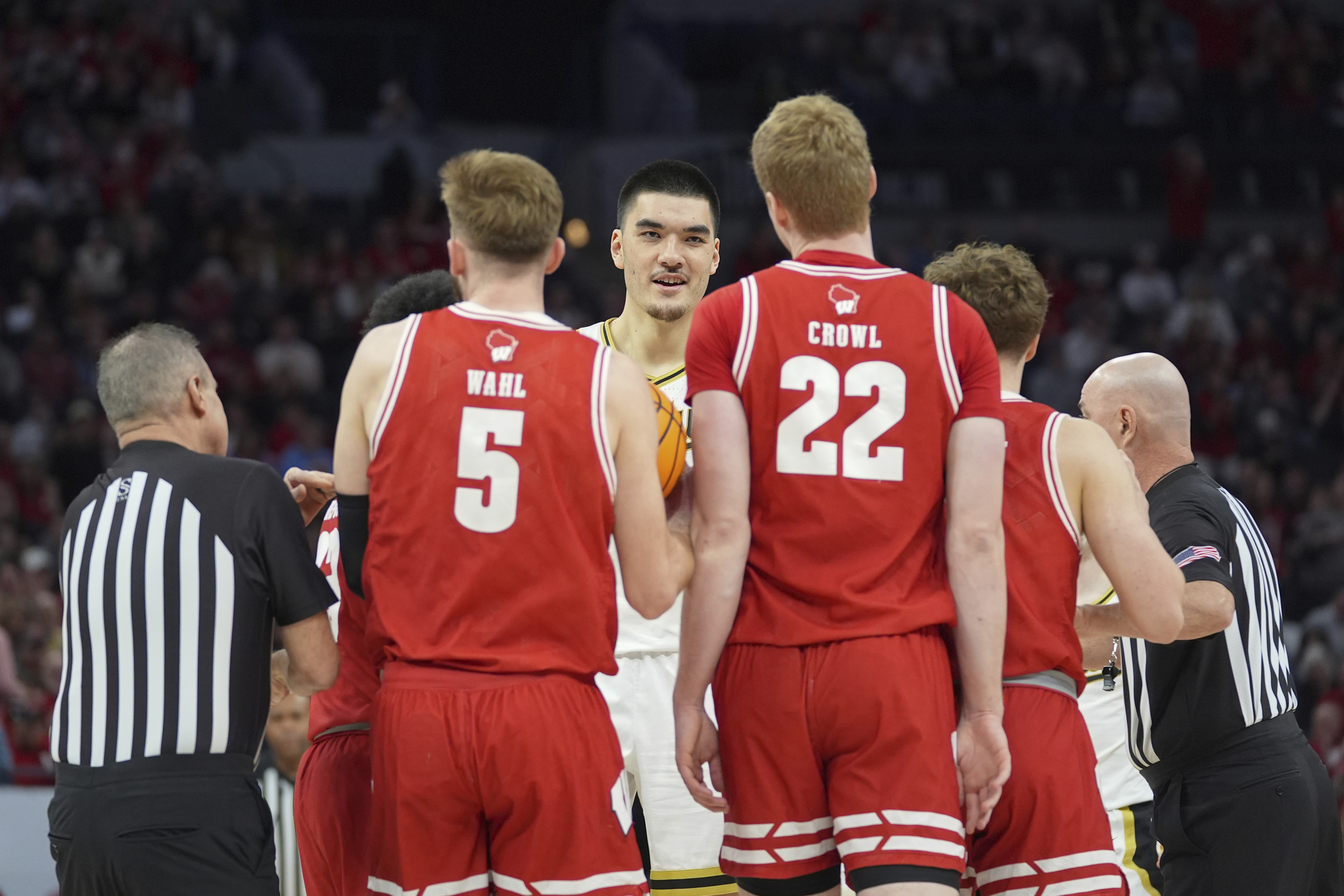Purdue center Zach Edey, center, gets into an altercation with Wisconsin players during the first half of an NCAA college basketball game in the semifinal round of the Big Ten Conference tournament, Saturday, March 16, 2024, in Minneapolis.