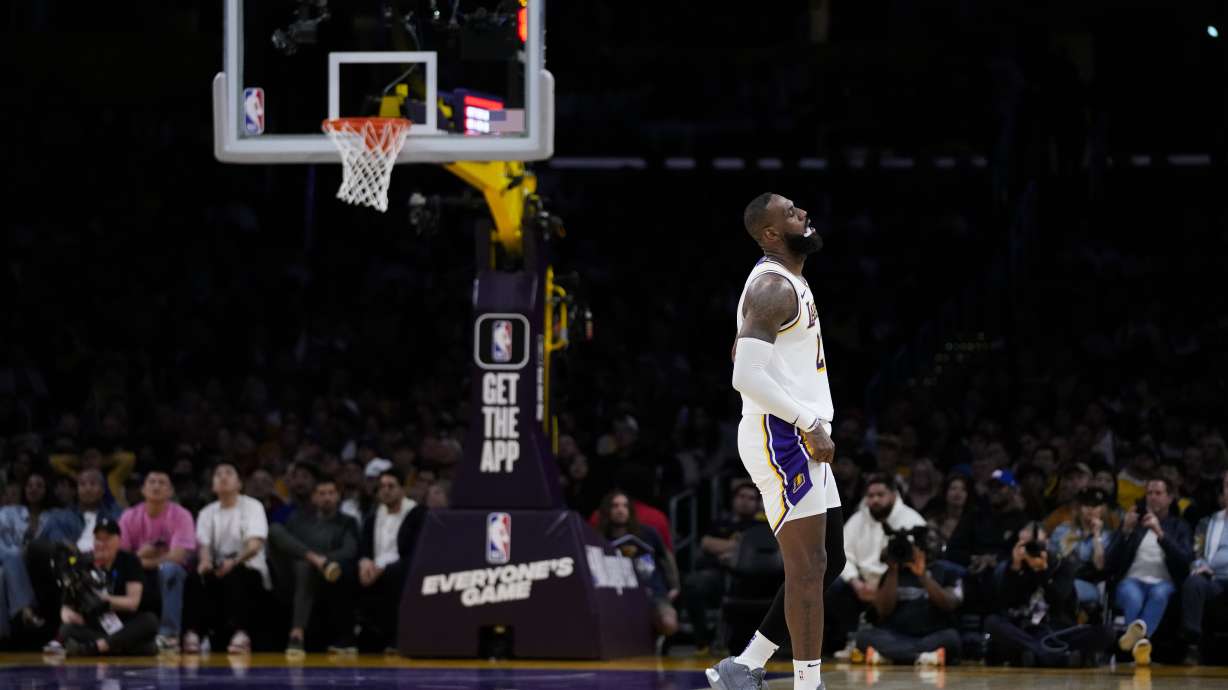 Los Angeles Lakers forward LeBron James (23) reacts after play was stopped due to a shot clock malfunction during the second half of an NBA basketball game against the Golden State Warriors in Los Angeles, Saturday, March 16, 2024.
