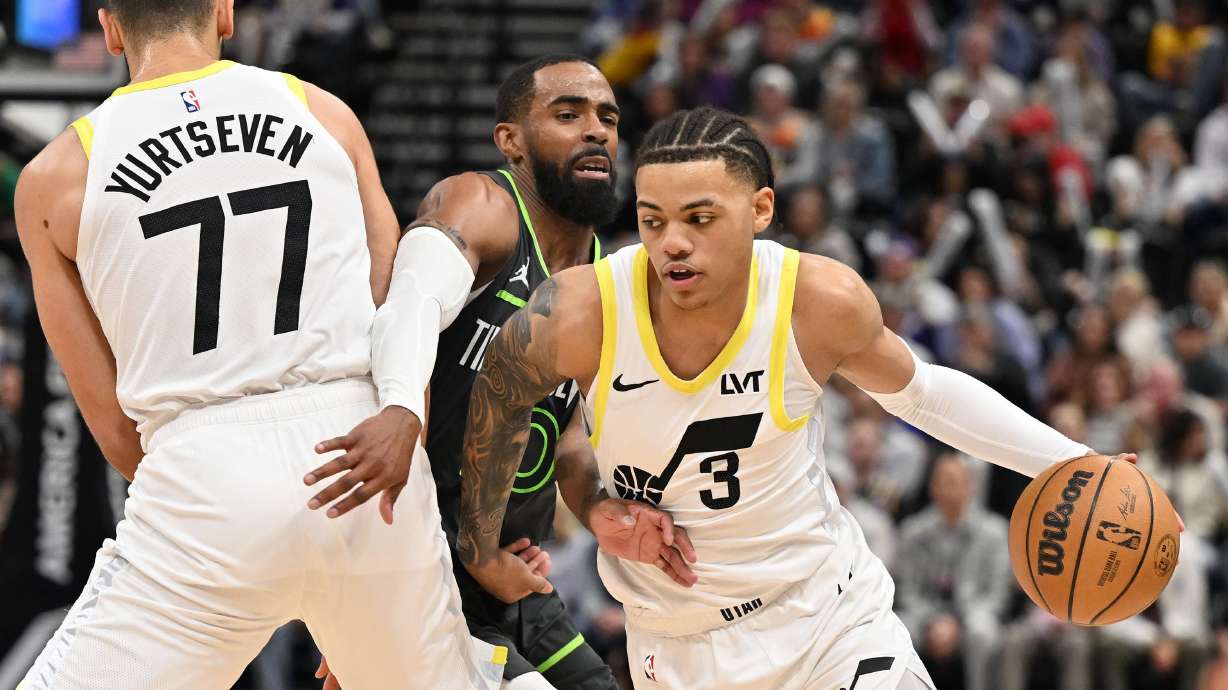 Utah Jazz guard Keyonte George (3) tries to shed Minnesota Timberwolves guard Mike Conley (10) with a screen by teammate Utah Jazz center Omer Yurtseven (77) as the Utah Jazz and Minnesota Timberwolves play at the Delta Center in Salt Lake City on Saturday, March 16, 2024. Minnesota won 119-100.