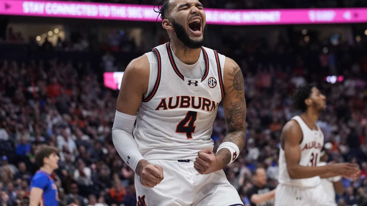 Auburn forward Johni Broome (4) reacts after a basket during the first half of an NCAA college basketball game against Florida in the fianls of the Southeastern Conference tournament Sunday, March 17, 2024, in Nashville, Tenn.