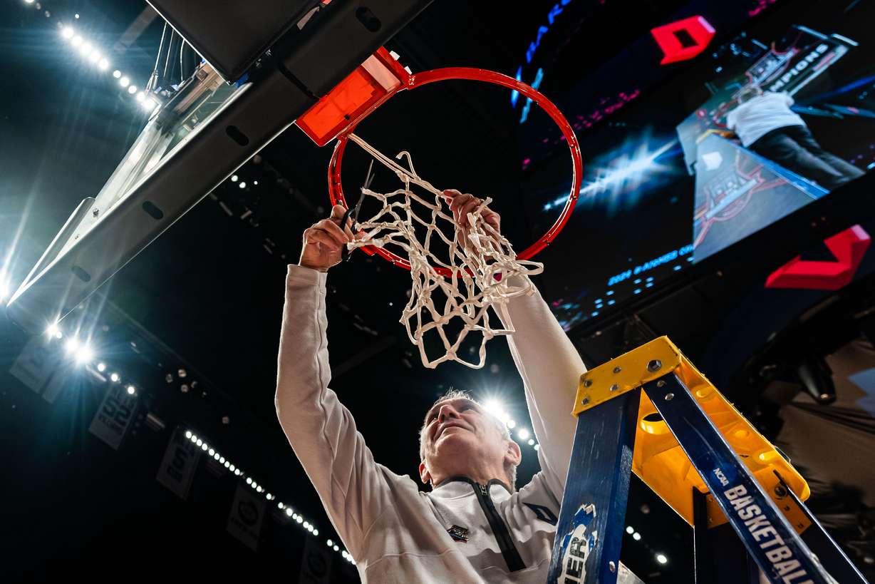 Duquesne head coach Keith Dambrot cuts the net after an NCAA college basketball game against Virginia Commonwealth in the championship of the Atlantic 10 Conference tournament Sunday, March 17, 2024, in New York.