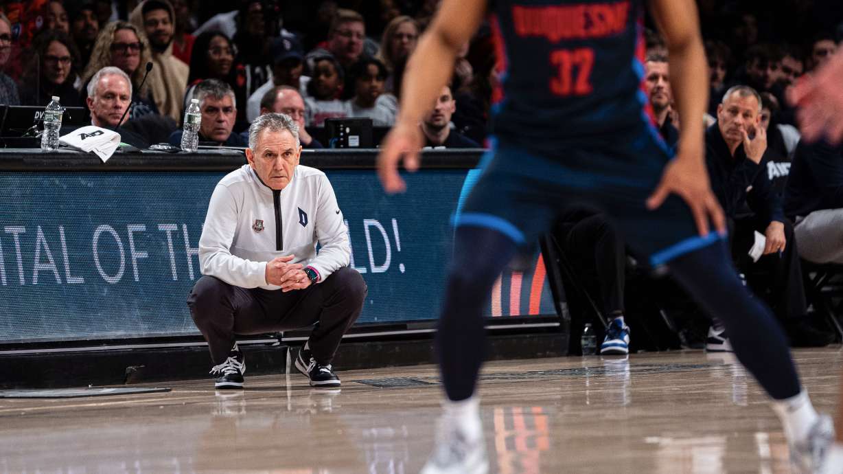 Duquesne head coach Keith Dambrot, left, watches his team during the first half of an NCAA college basketball game against VCU in the championship of the Atlantic 10 Conference tournament on Sunday, March 17, 2024, in New York.