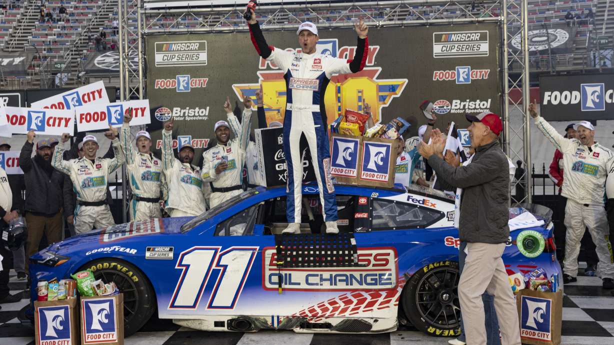 Denny Hamlin, center, celebrates after winning a NASCAR Cup Series auto race, Sunday, March 17, 2024, in Bristol, Tenn.