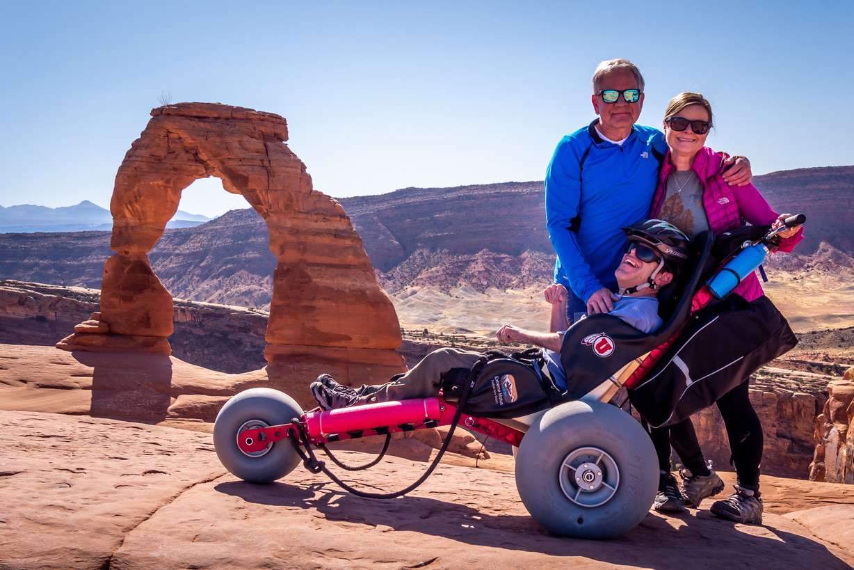Sam Durst with his parents, Christine and Roger Durst, at Arches National Park.