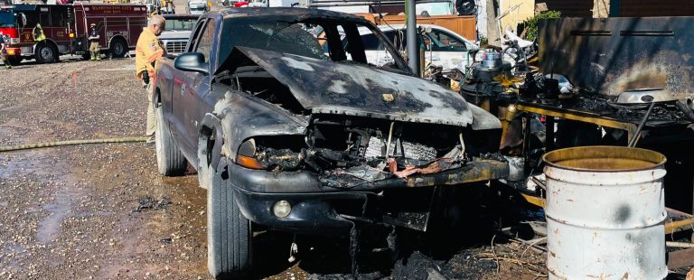 A burned truck sits in a yard at 925 S. 1775 East, in Washington, Sunday.