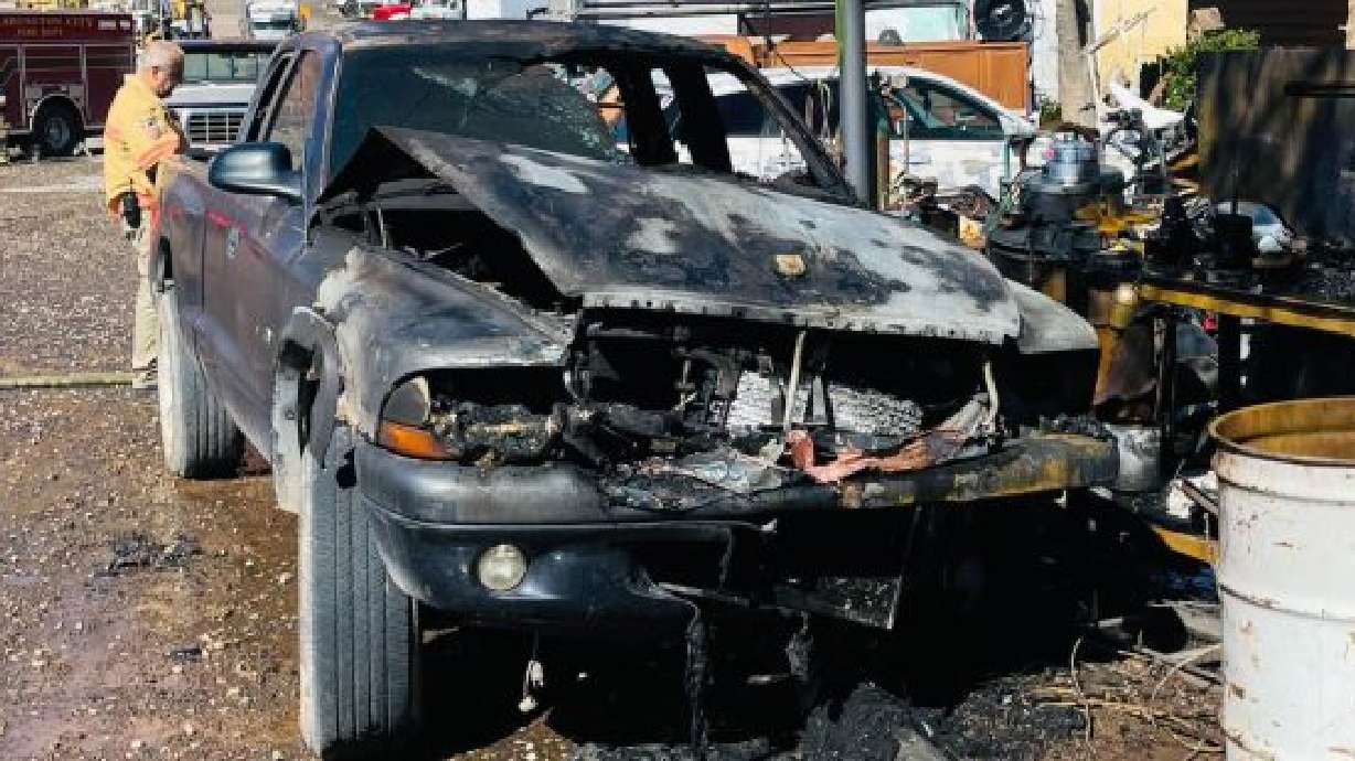 A burned truck sits in a yard at 925 S. 1775 East, in Washington, Sunday.
