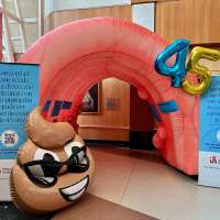 2 giant inflatable colons help Intermountain Health cancer experts raise colon cancer awareness