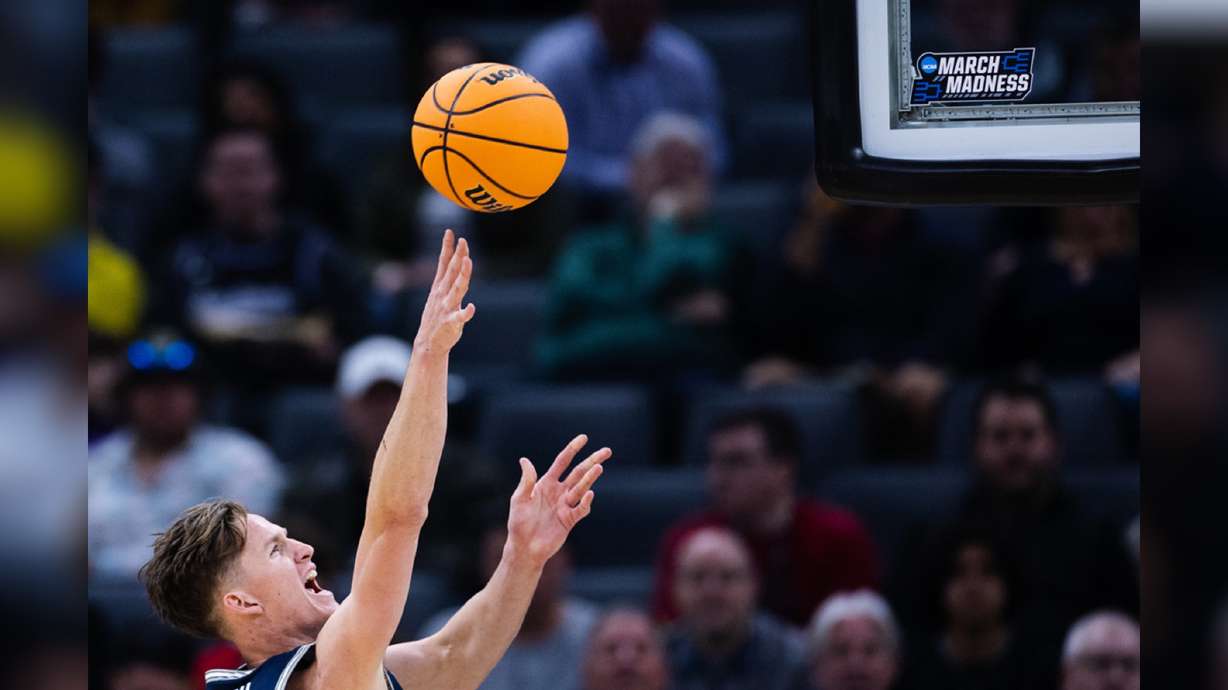 Utah State Aggies guard Sean Bairstow lays the ball up during the first round of the NCAA men’s basketball tournament in Sacramento on March 16, 2023. Experts say artificial intelligence has been used by bracketologists for years and is always evolving.
