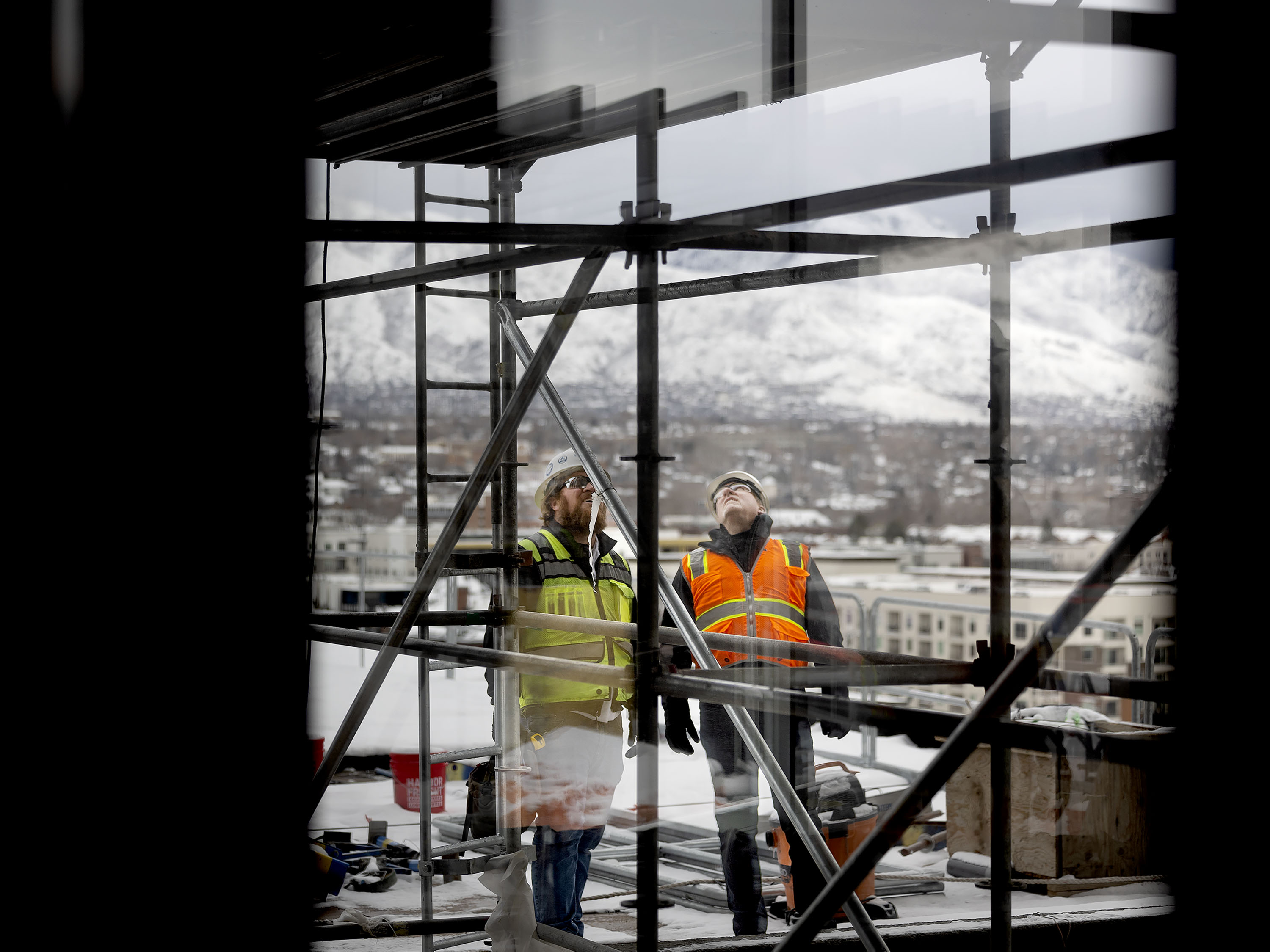 Patrick Taylor, project supervisor of The Worthington, and Dave Layton, president & CEO of Layton Construction,  survey the construction of The Worthington in Salt Lake City on Jan. 11.